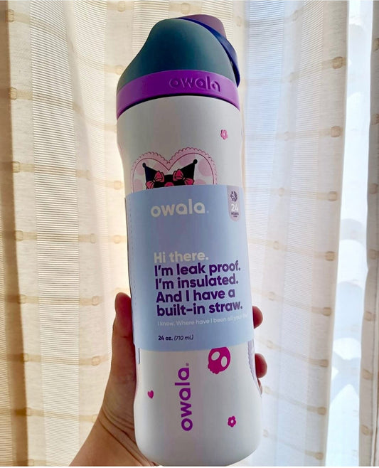 Owala water bottle held by a person with a blurred background